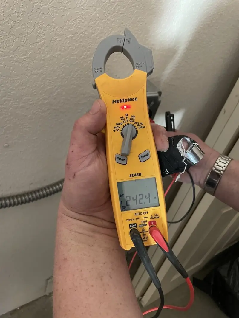 Voltage testing with clamp meter during Electrical Installation Services in Shawano